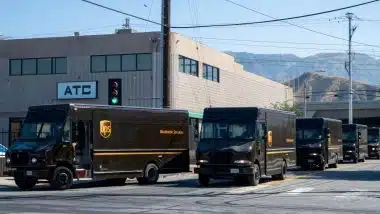 UPS (United Parcel Service) drivers and delivery trucks. Residential delivery service.