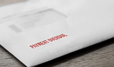 Payment overdue letter stamped in red on an evelope.