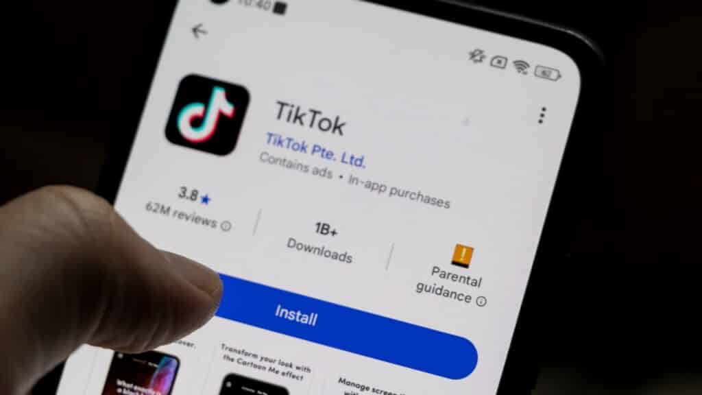A smartphone displaying the TikTok app, featuring download statistics, ratings, and installation button.