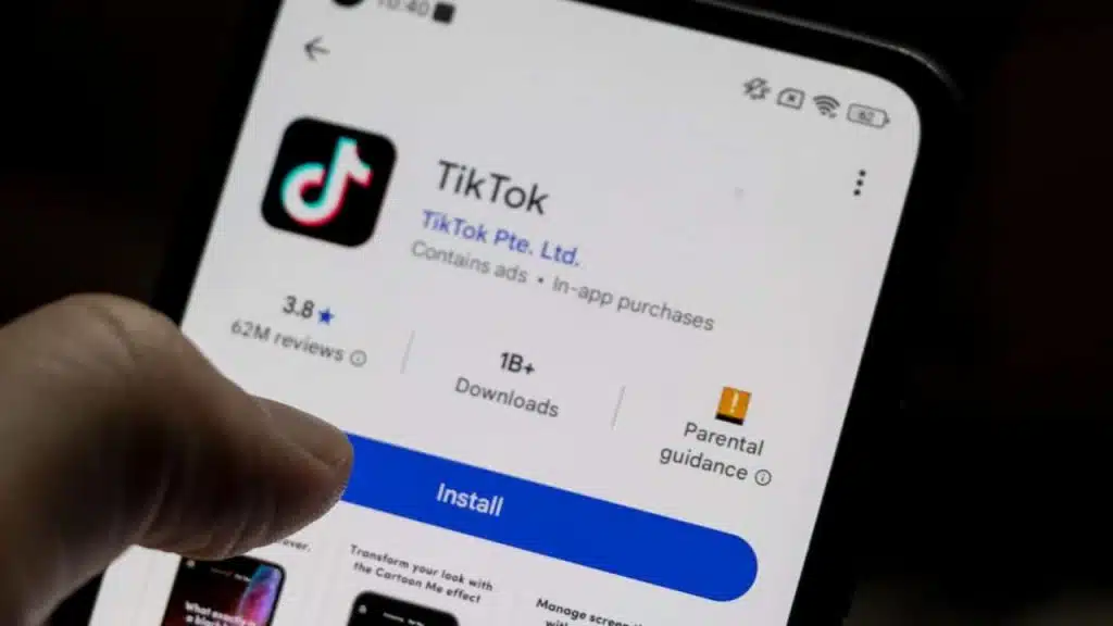 A smartphone displaying the TikTok app, featuring download statistics, ratings, and installation button.