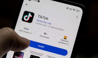 A smartphone displaying the TikTok app, featuring download statistics, ratings, and installation button.