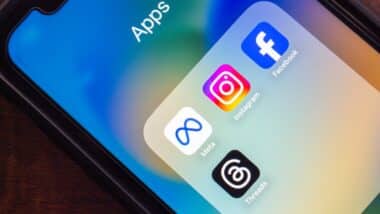 Close-up of smartphone showing Meta-owned apps