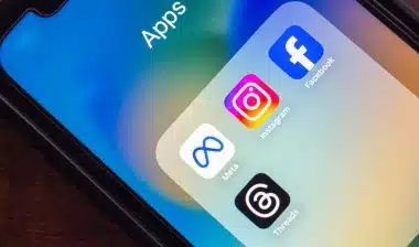 Close-up of smartphone showing Meta-owned apps