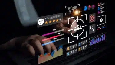 A person interacts with a laptop, surrounded by a dynamic digital interface showcasing various metrics