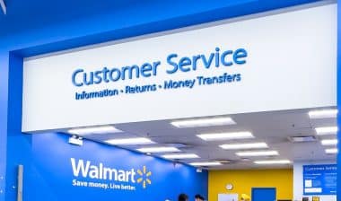 Wide-angle shot of customers at a Walmart customer service desk