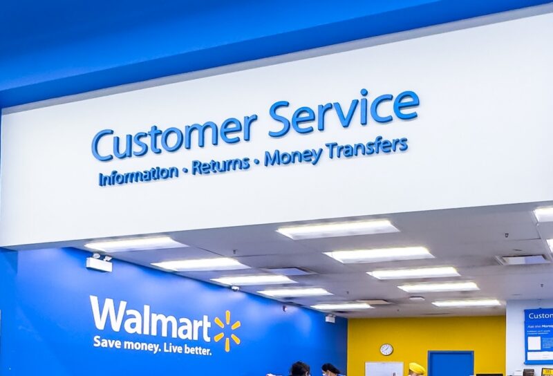 Wide-angle shot of customers at a Walmart customer service desk
