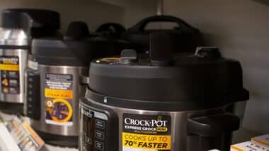 A view of several Crock Pot slow cooker appliances on display at a local department store.