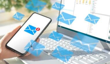 cell phone and laptop with lots of message icons