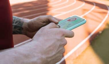 man hand with tracking app on mobile phone