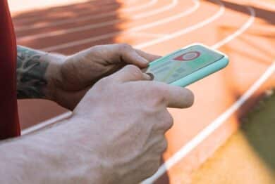 man hand with tracking app on mobile phone