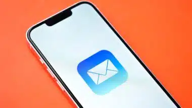 Apple mail app on phone screen stock image.