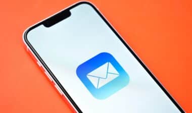 Apple mail app on phone screen stock image.