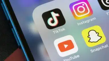 TikTok, Instagram, YouTube, and Snapchat app icons are seen on an iPhone.