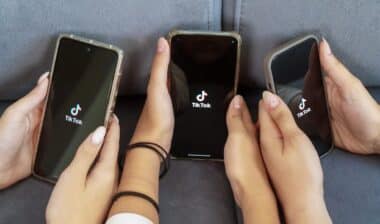 teenage girls with phone in their hands