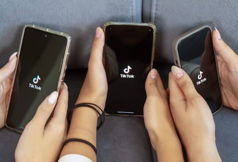 teenage girls with phone in their hands