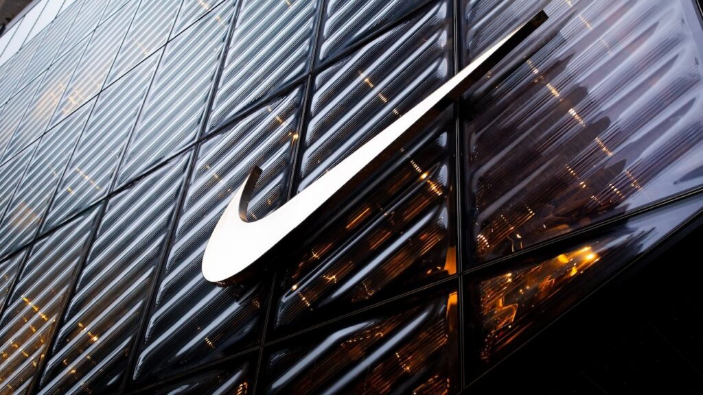 NIKE logo sign on the company store facade on 5th Ave. in Manhattan, NYC.