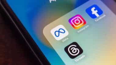 Smartphone screen showing Meta, Instagram, Facebook, and Threads app icons, representing Meta's social networking tools and platforms.