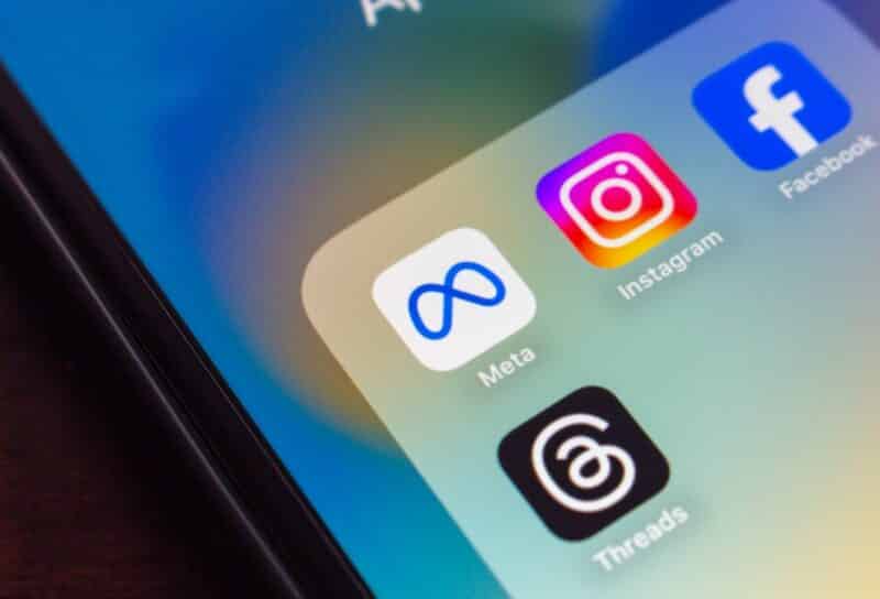 Smartphone screen showing Meta, Instagram, Facebook, and Threads app icons, representing Meta's social networking tools and platforms.