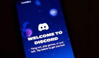 A smartphone screen displays the Discord app.