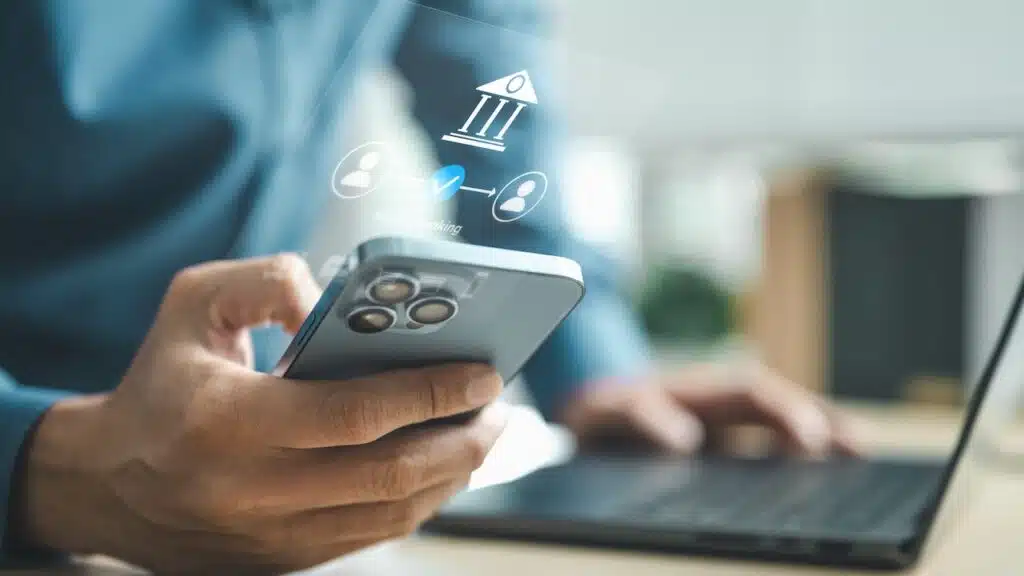 Business professional using smartphone for mobile banking with digital bank interface, representing online payment, secure transaction and financial technology innovation concept.