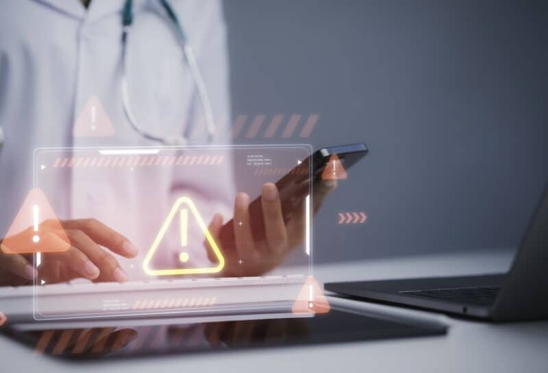 Healthcare cybersecurity alert concept featuring medical professional