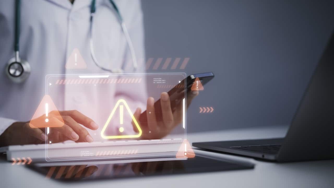 Healthcare cybersecurity alert concept featuring medical professional