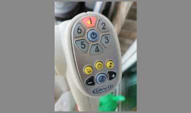 A close-up of the Graco baby swing's control panel
