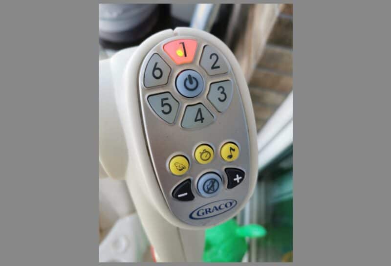 A close-up of the Graco baby swing's control panel