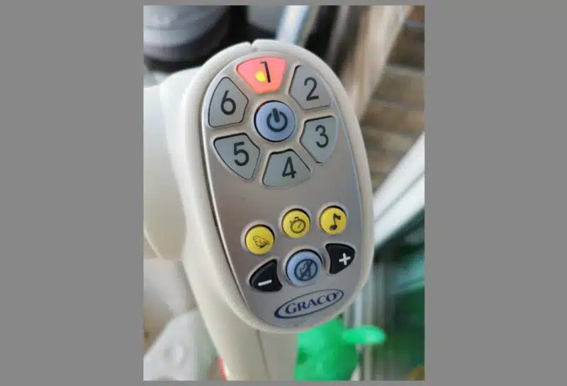 A close-up of the Graco baby swing's control panel