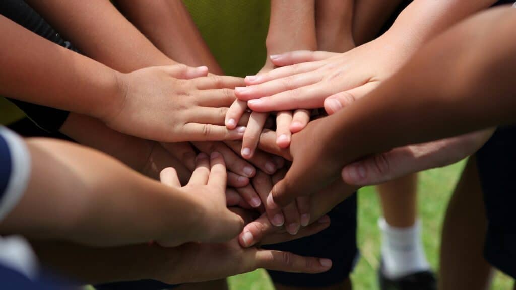 group of young people's hands