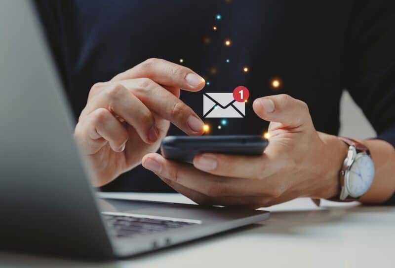 Hand of businessman using smartphone for email with notification alert, Online communication concept.