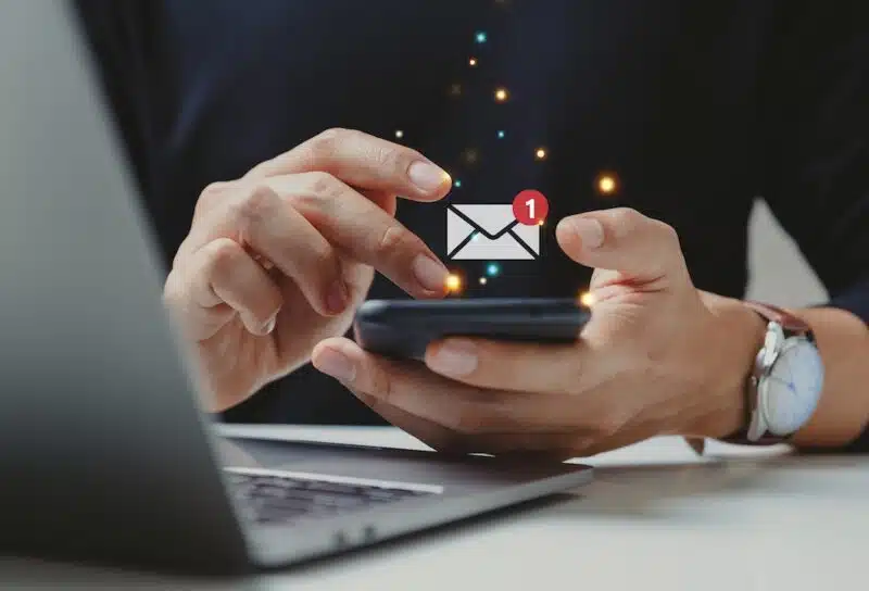 Hand of businessman using smartphone for email with notification alert, Online communication concept.