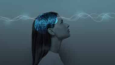 Young girl with closed eyes and neon glowing brain.