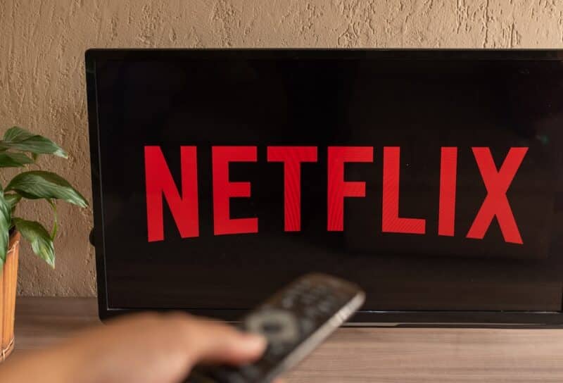 TV Television Netflix logo on screen with home remote control.