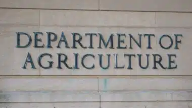 Exterior of Building of Department of Agriculture and a metallic writing that says Department of Agriculture on stones