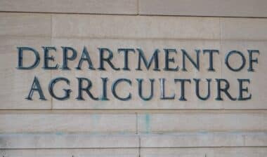 Exterior of Building of Department of Agriculture and a metallic writing that says Department of Agriculture on stones