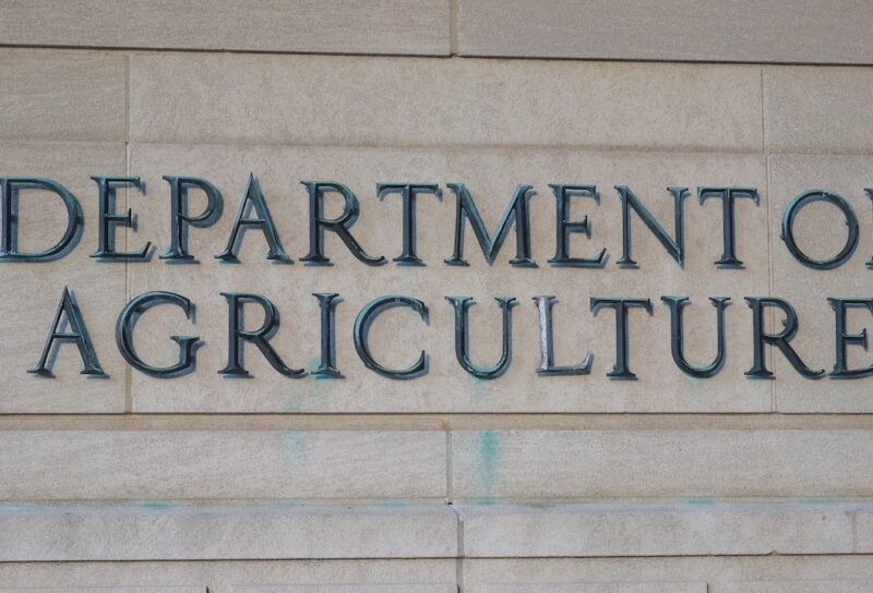 Exterior of Building of Department of Agriculture and a metallic writing that says Department of Agriculture on stones