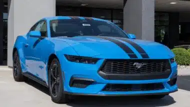 Ford Mustang EcoBoost Coupe display at a dealership.