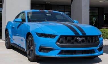Ford Mustang EcoBoost Coupe display at a dealership.