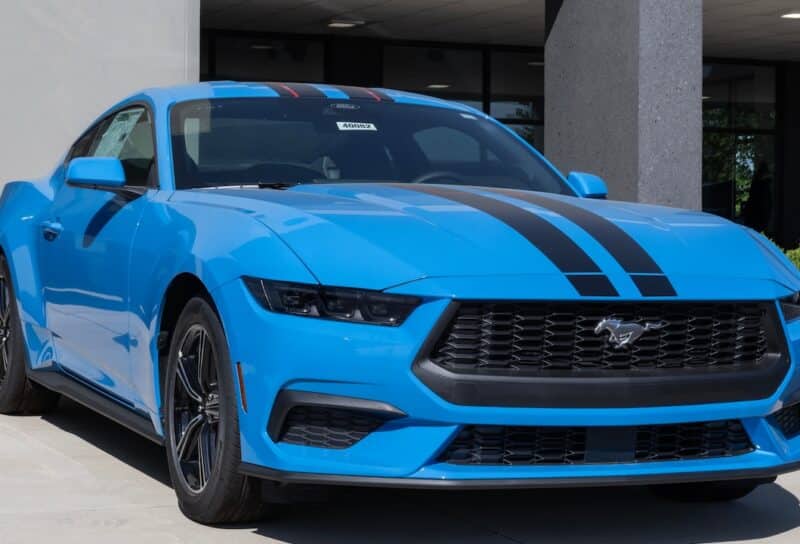 Ford Mustang EcoBoost Coupe display at a dealership.