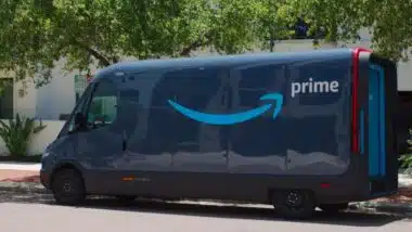 Branded Dark Blue Amazon Delivery Van from an Online Logistics Service in a Residential Area