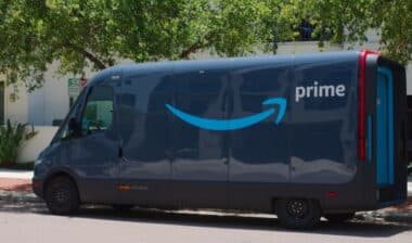 Branded Dark Blue Amazon Delivery Van from an Online Logistics Service in a Residential Area