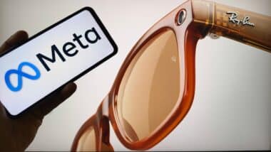 Ray-Ban Meta smart glasses next to smartphone displaying Meta logo,