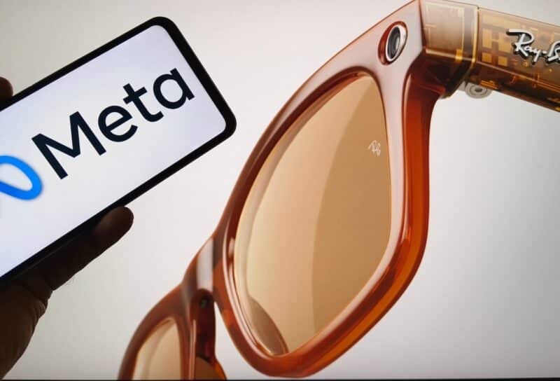 Ray-Ban Meta smart glasses next to smartphone displaying Meta logo,