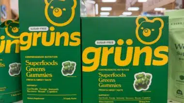 Grüns Superfoods Greens Gummies Boxes on Grocery Shelf.