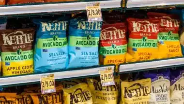 Bags Of Kettle Brand Potato Chips Displayed On Store Shelf In Snack Foods Aisle