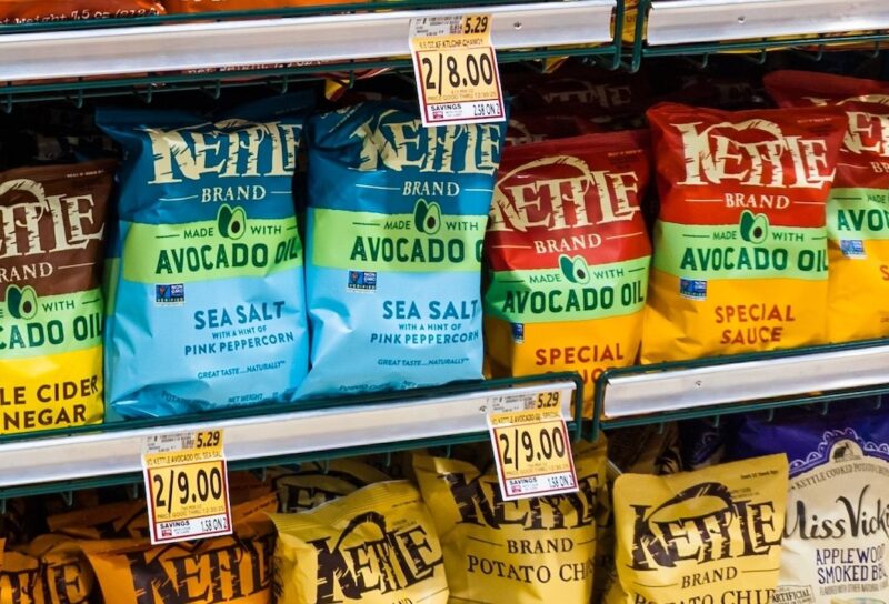Bags Of Kettle Brand Potato Chips Displayed On Store Shelf In Snack Foods Aisle