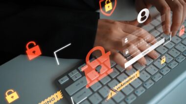 Modern Digital Security Concept with Hands Typing on Keyboard Surrounded by Virtual Locks and Warning Icons