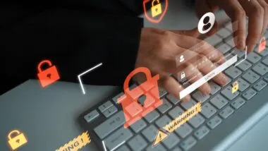 Modern Digital Security Concept with Hands Typing on Keyboard Surrounded by Virtual Locks and Warning Icons