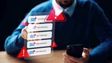 Receiving scam call sms messages with alert icons on a phone screen